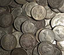 Load image into Gallery viewer, Pile of Canadian 80% pure silver circulation coins with King George VI and Queen Elizabeth II portraits.